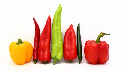 Composition of several types of sweet pepper of different shapes, colors and sizes on a light background. Natural product. Natural color. Close-up.