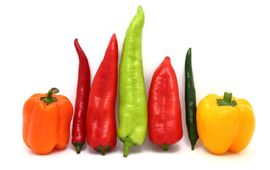 Composition of several types of sweet pepper of different shapes, colors and sizes on a light background. Natural product. Natural color. Close-up.