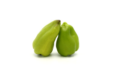 Two sweet peppers of green color on a light background. Natural product. Natural color. Close-up.