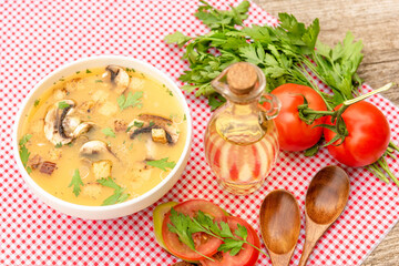 Mushroom vegetarian soup and a sandwich with tomatoes and herbs for lunch.