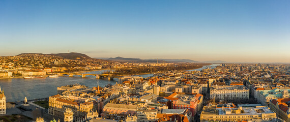 Fototapeta premium Panoramic aerial drone shot of Margaret Island in Danube river in Budapest sunrise morning glow