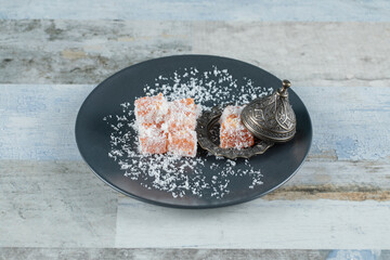 Lokum candies in black plate