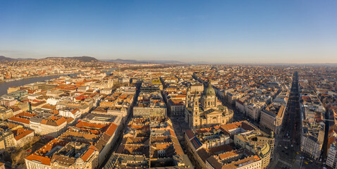 Panoramic drone shot of St. Stephen's Basilica in Budapest sunrise morning glow