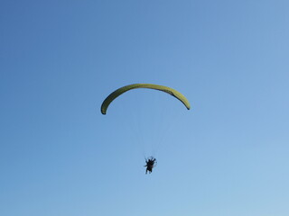 paragliding in the blue sky