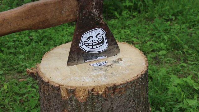 Troll face woodcutter destroys lol face. Troll face vs LOL face.  Axe of a funny lumberjack.