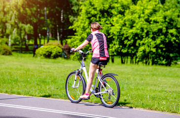 Cyclist ride on the bike path in the city Park
