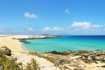 Tropical beach, azure ocean water and blue sky. Paradise landscape. Panorama