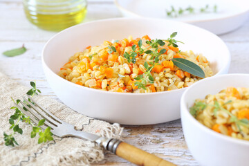 Pearl barley warm salad with carrots and fried onions, thyme garnish