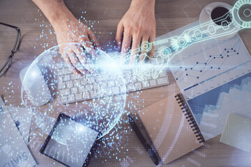 Double exposure of man's hands typing over computer keyboard and data theme hologram drawing. Top view. Technology concept.