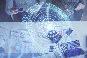 Double exposure of man and woman working together and data theme hologram drawing. Computer background. Top View.