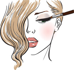 Beautiful girl with a makeup brush