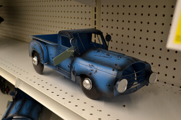 A Blue Truck Available for Purchase Inside of a Retail Store