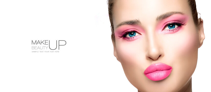 Beauty and Makeup Concept. High fashion model girl with bright pink makeup