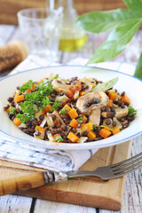 Lentil salad with carrots, fried mushrooms and parsley