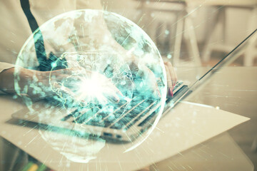 Multi exposure of woman hands typing on computer and business theme hologram drawing. Success...