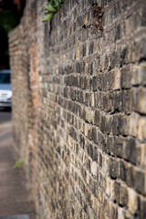 a side view of the old brick wall
