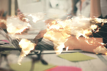 Multi exposure of woman hands typing on computer and business theme hologram drawing. Success concept.