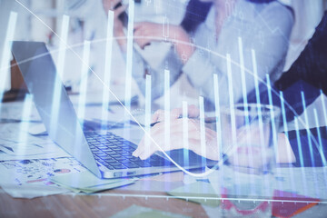 Multi exposure of woman hands typing on computer and forex chart hologram drawing. Stock market analysis concept.