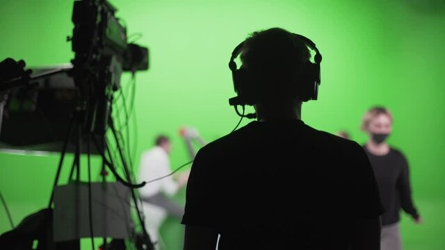 Film Crew In Green Studio