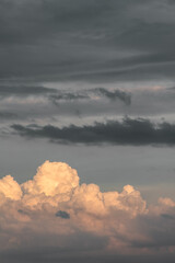 white cumulus rain cloud in sunset