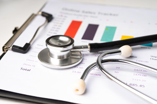 Stethoscope on chart or graph paper, Financial, account, statistics and business data  medical health concept.