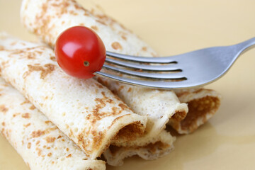 Pancakes and close up tomato
