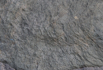 texture of dark gray textured granite, closeup.