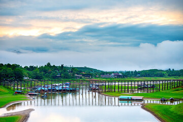 Morning light Mon Bridge in Kanchanaburi.This Wooden Mon Bridge is officially named Uttama Nusorn Bridge. It was built in order to connect with Mon village and Songalia village.