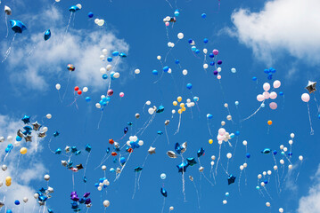 Balloons in a Cloudy Sky