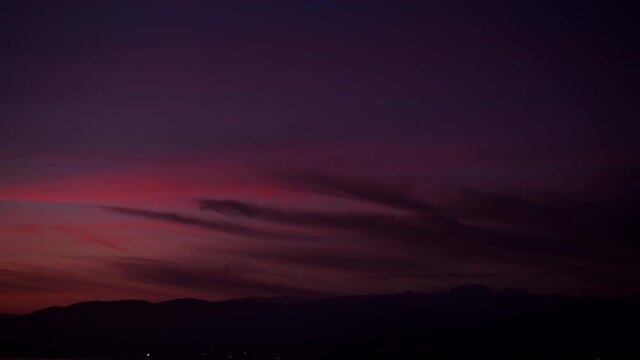 Time lapse of sunset and nightfall over Sierra Nevada mountain range in Spain. Nature landscape