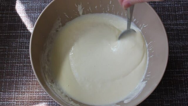 A Hand Is Stirring The Pancake Batter 