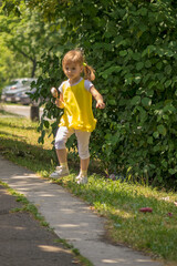 Fototapeta premium little girl in yellow dress