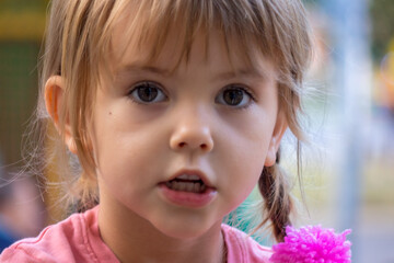 a girl with a pompom