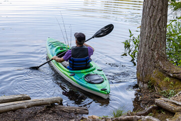 man kayaking in the lake
