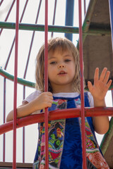 Girl in a park on equipment