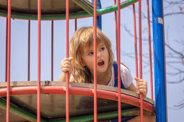 Girl in a park on equipment