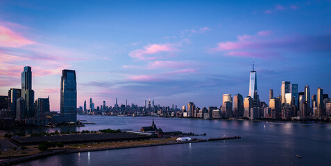 Fototapeta na wymiar Amazing Panorama view of the Skyline of Manhattan and Jersey City, New York City, United States. Shot from Hudson River 
