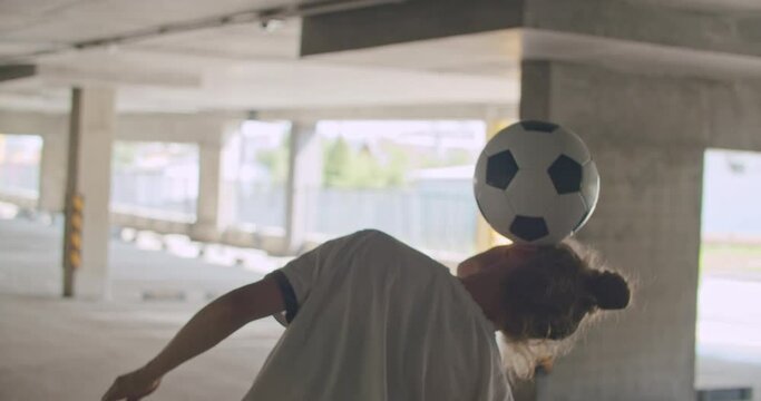 Teenager girl football soccer player practicing