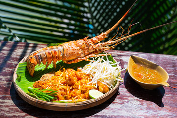 Pad Thai fried noodle thai style with prawns and Lobster