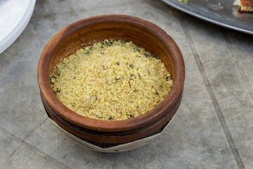 Handmade clay container with flour.