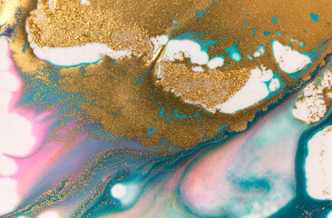 Golden glitter scattering background. Sparkling gold and blue texture.