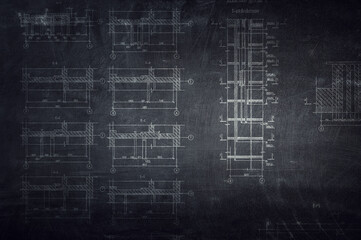 Architectural drafts on black board . Mixed media