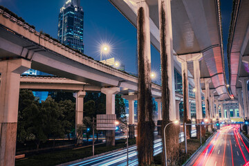 nNight view of the traffic under a overpass bridge in Shanghai, China.