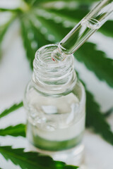 Cosmetics with cannabis oil on a white background. The concept of luxurious skin care.