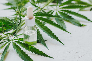 Cosmetics with cannabis oil on a white background. The concept of luxurious skin care.