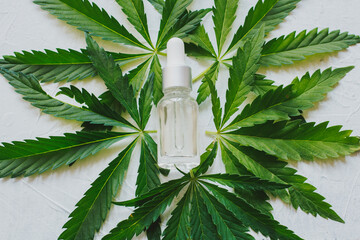 Cosmetics with cannabis oil on a white background. The concept of luxurious skin care.