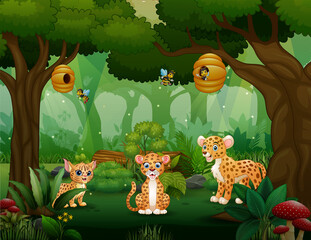 Obraz premium Cartoon leopard family playing in the middle of forest