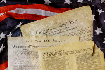 Aged historical documents Washington DC on American Declaration of independence 4th july 1776 on USA flag
