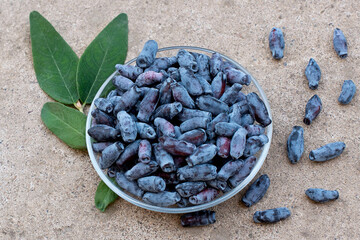 honeysuckle berries on a concrete background.