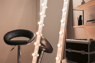 Stylish interior of modern makeup room in evening